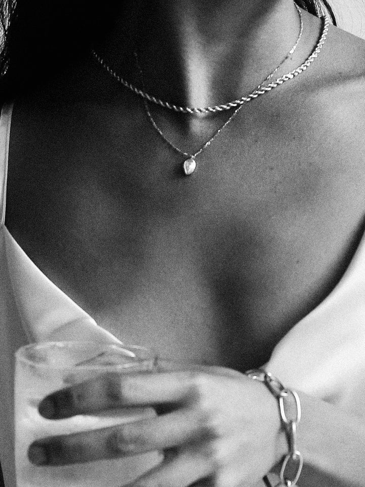 Industrial Rope Chain shot on model layered with another necklace